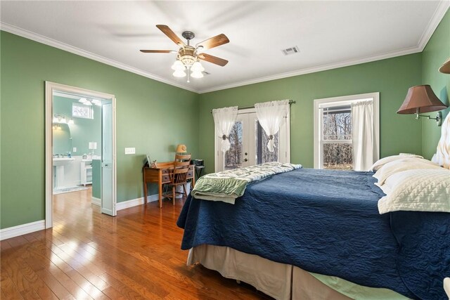 bedroom featuring wood-type flooring, ceiling fan, and crown molding