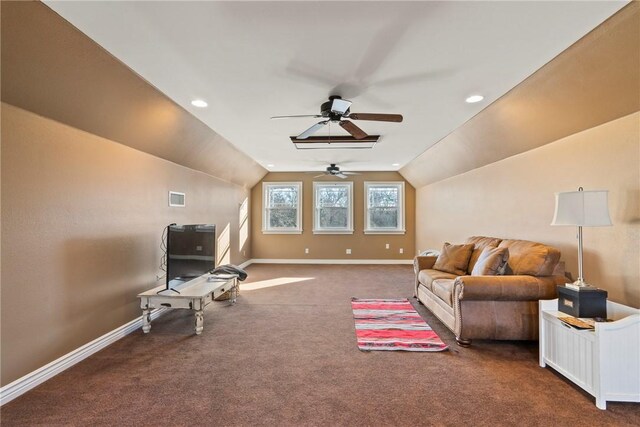 carpeted living room featuring vaulted ceiling and ceiling fan