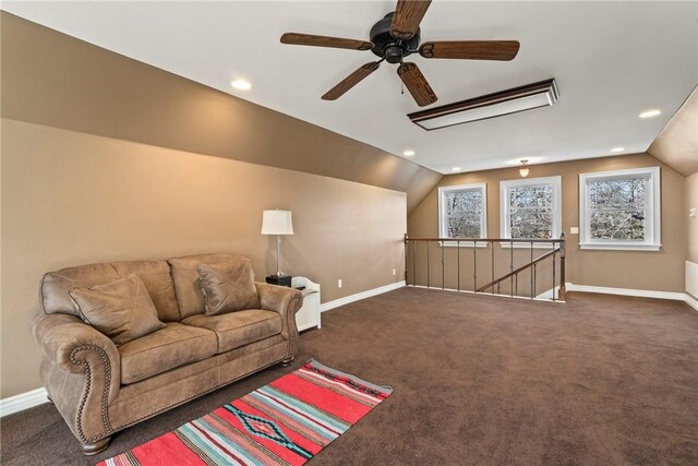 carpeted living room with lofted ceiling