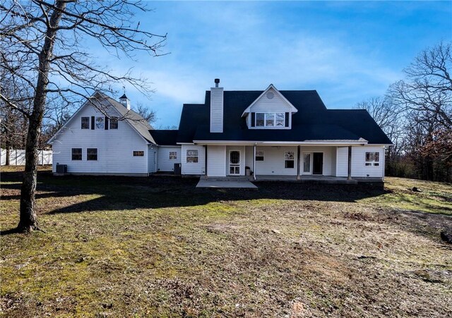 view of front of property with a patio area and a front yard