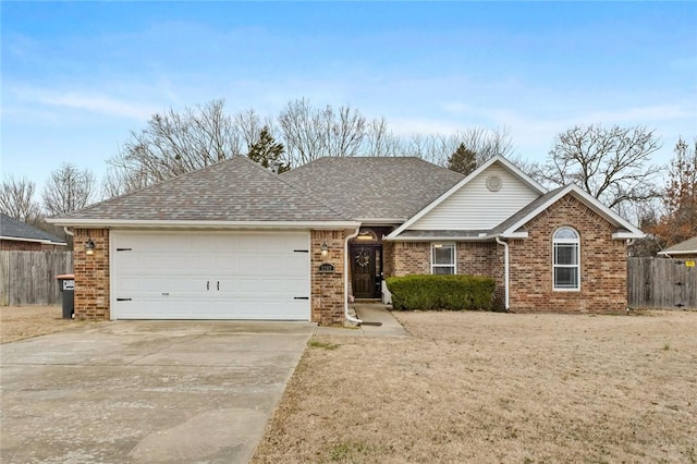 ranch-style house featuring a garage and a front lawn