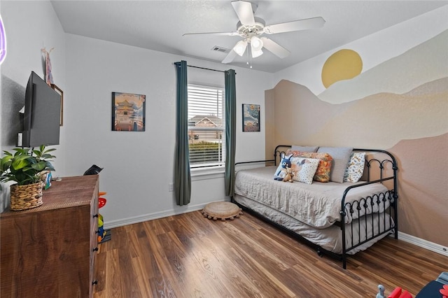 bedroom with dark hardwood / wood-style floors and ceiling fan