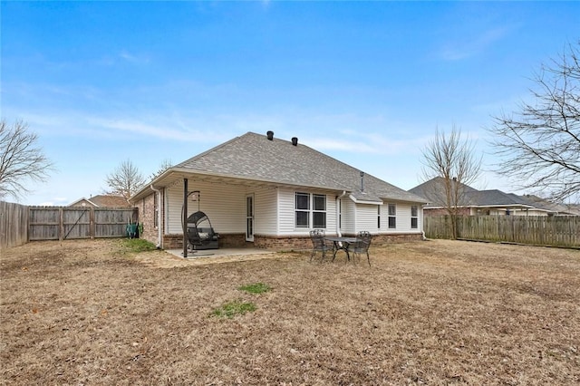 rear view of property featuring a patio area