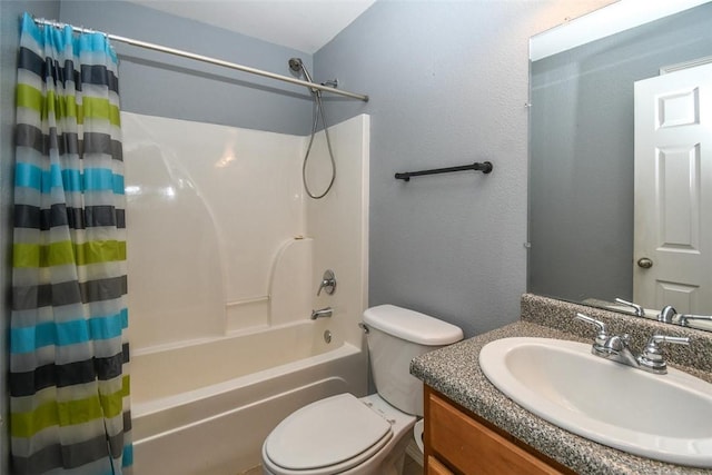 bathroom featuring toilet, shower / bathtub combination with curtain, and vanity