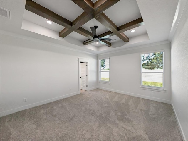 carpeted empty room featuring ceiling fan, coffered ceiling, and beam ceiling