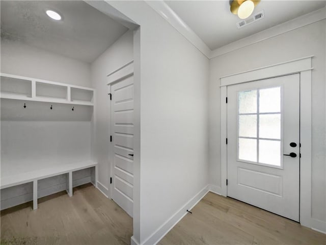 mudroom with light hardwood / wood-style floors