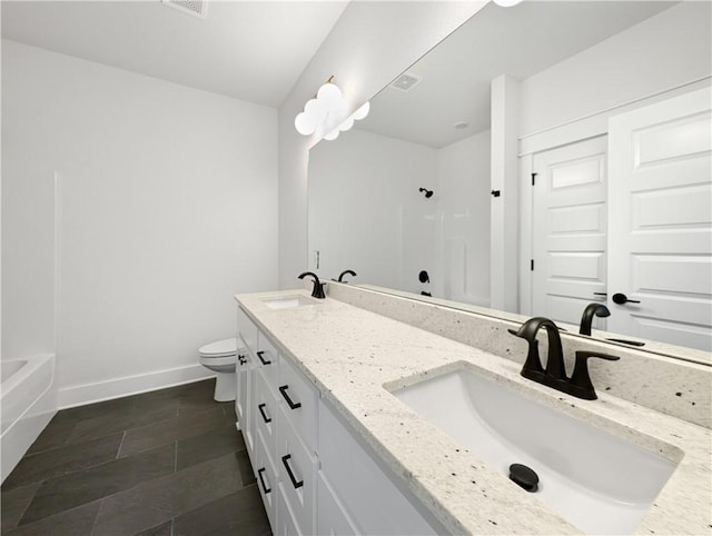 bathroom with vanity and toilet