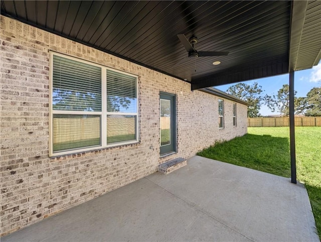 view of patio featuring ceiling fan