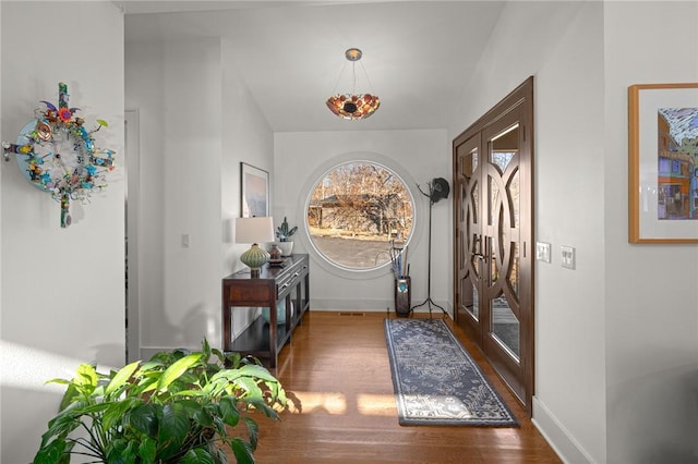 foyer entrance with dark hardwood / wood-style flooring