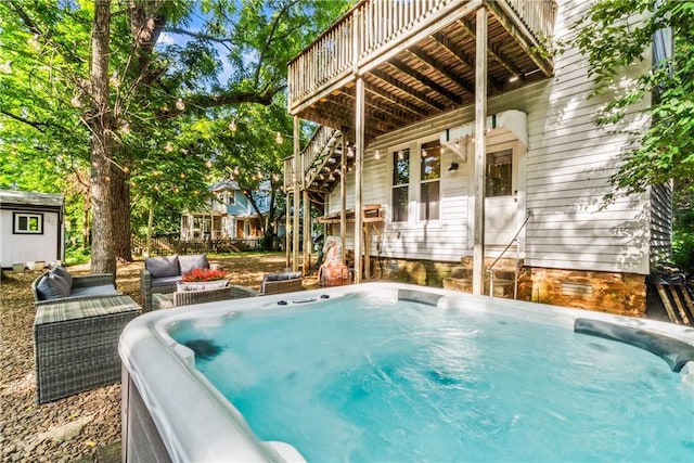 view of pool with an outdoor hangout area, a hot tub, and a deck