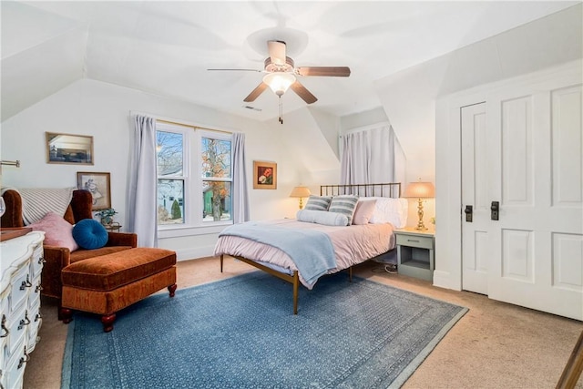 carpeted bedroom featuring lofted ceiling and ceiling fan