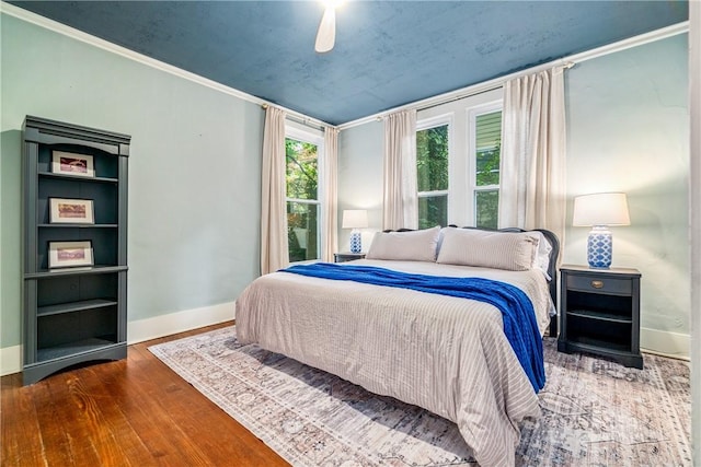 bedroom with hardwood / wood-style floors