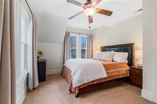 carpeted bedroom featuring lofted ceiling and ceiling fan