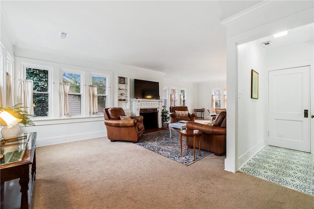 carpeted living room featuring ornamental molding and a brick fireplace