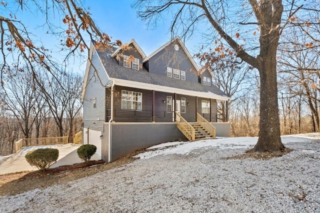 view of front of house with a garage and covered porch