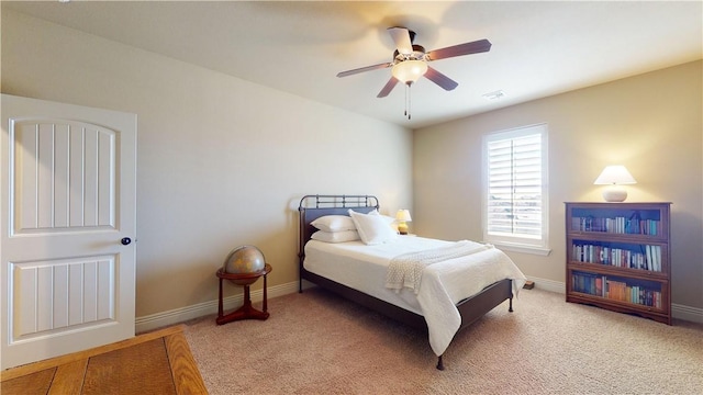 carpeted bedroom with ceiling fan