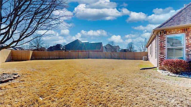 view of yard with central AC unit