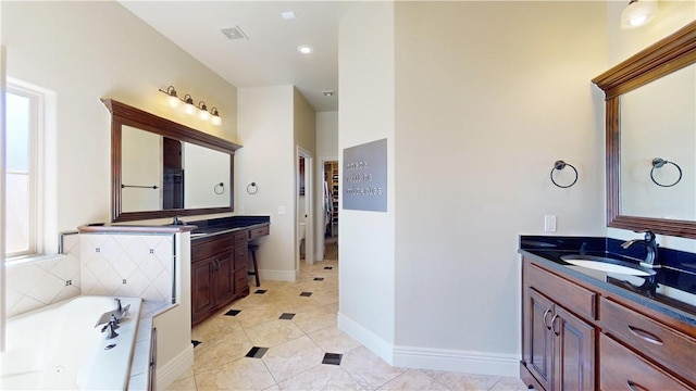 bathroom with vanity, tile patterned floors, and a bathing tub