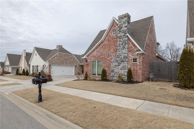 view of front of home with a garage and a front yard