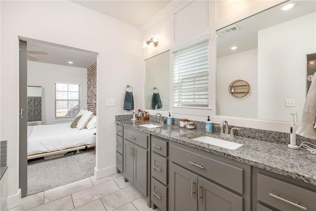 bathroom featuring tile patterned flooring and vanity