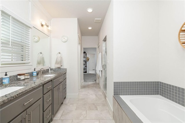 bathroom with vanity, tile patterned floors, and separate shower and tub