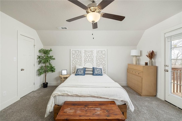 bedroom featuring vaulted ceiling, carpet flooring, ceiling fan, and a textured ceiling