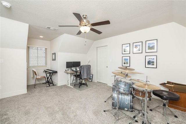 office with vaulted ceiling, carpet flooring, ceiling fan, and a textured ceiling