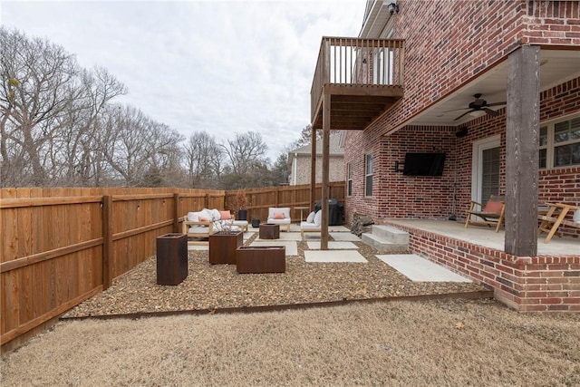 view of patio / terrace featuring a balcony, an outdoor hangout area, and ceiling fan