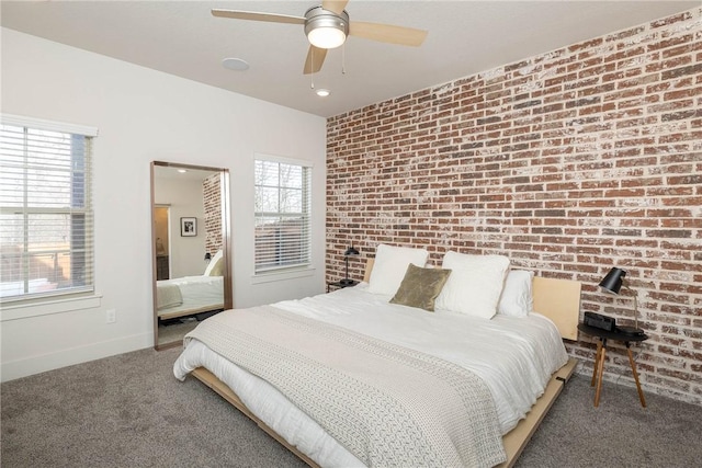 carpeted bedroom featuring ceiling fan and brick wall