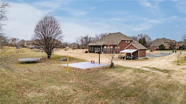 view of yard with a trampoline