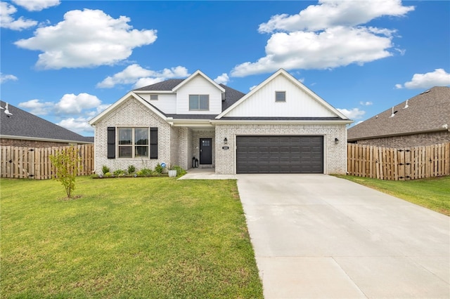 view of front of property with a garage and a front yard