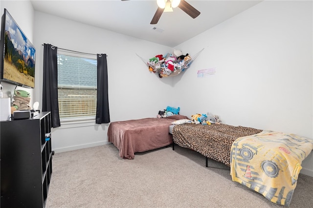 carpeted bedroom with ceiling fan