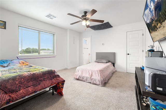 carpeted bedroom featuring ceiling fan