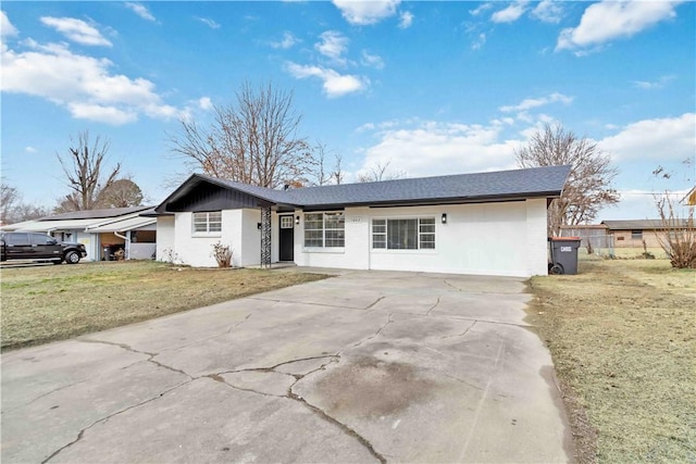 ranch-style house with a front lawn