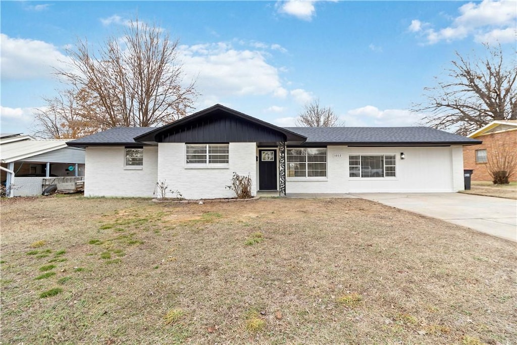 ranch-style house with a front lawn