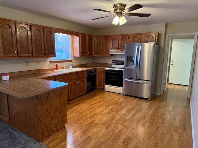 kitchen with stainless steel refrigerator with ice dispenser, sink, light hardwood / wood-style flooring, dishwasher, and white range with electric stovetop