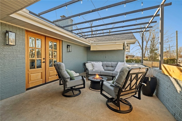 view of patio featuring a pergola, an outdoor living space with a fire pit, and french doors