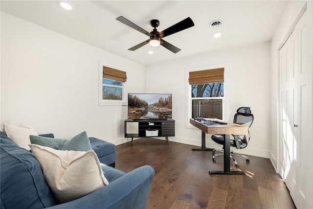 office space with dark hardwood / wood-style floors and ceiling fan