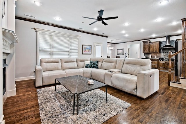 living room featuring crown molding, ceiling fan, and dark hardwood / wood-style floors