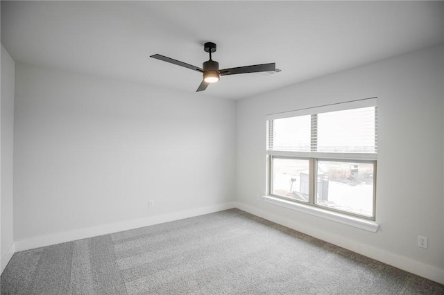 unfurnished room featuring carpet and ceiling fan