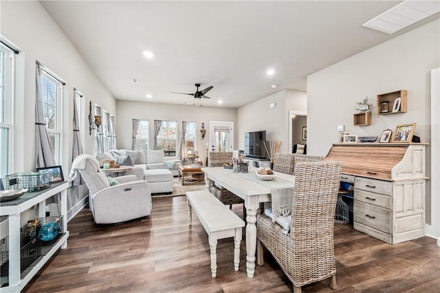 dining area featuring ceiling fan and dark hardwood / wood-style floors