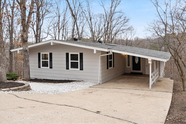 ranch-style home with a carport