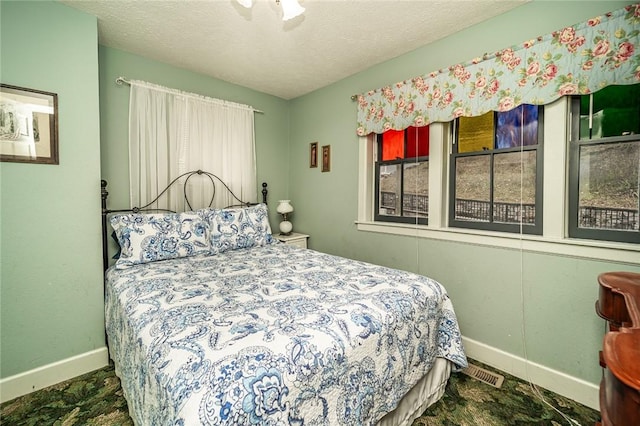 bedroom featuring a textured ceiling