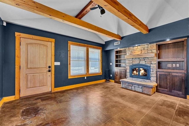 unfurnished living room with built in features, a stone fireplace, vaulted ceiling with beams, and radiator