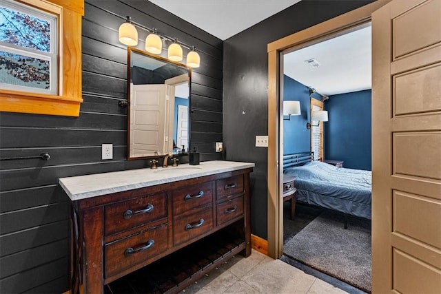 bathroom with vanity and tile patterned floors