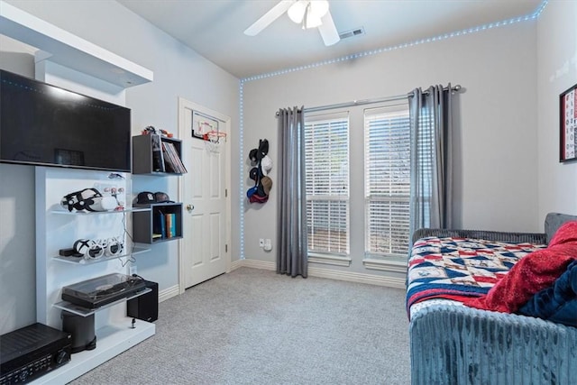 bedroom featuring light colored carpet and ceiling fan