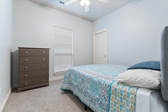 bedroom with light colored carpet and ceiling fan