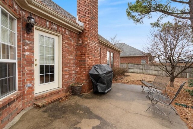 view of patio featuring a grill