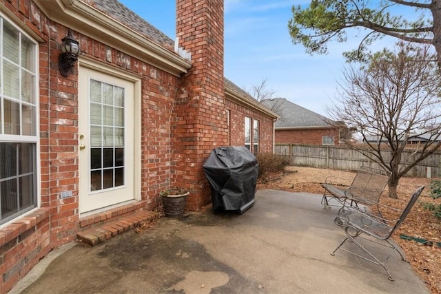 view of patio with fence and grilling area