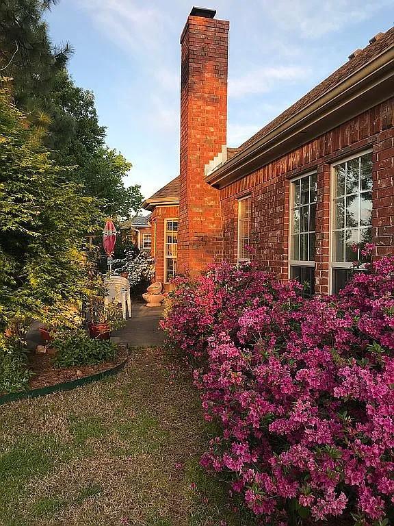 view of side of home featuring a patio area